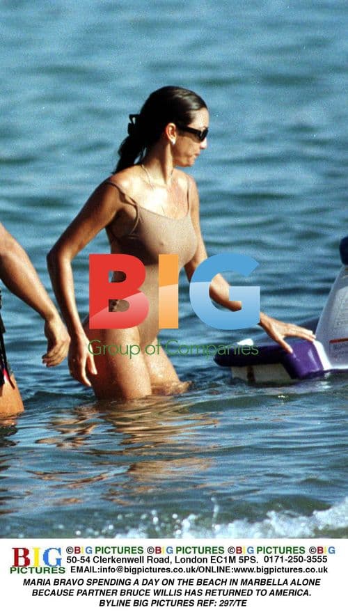 Maria Bravo on beach in Marbella alone