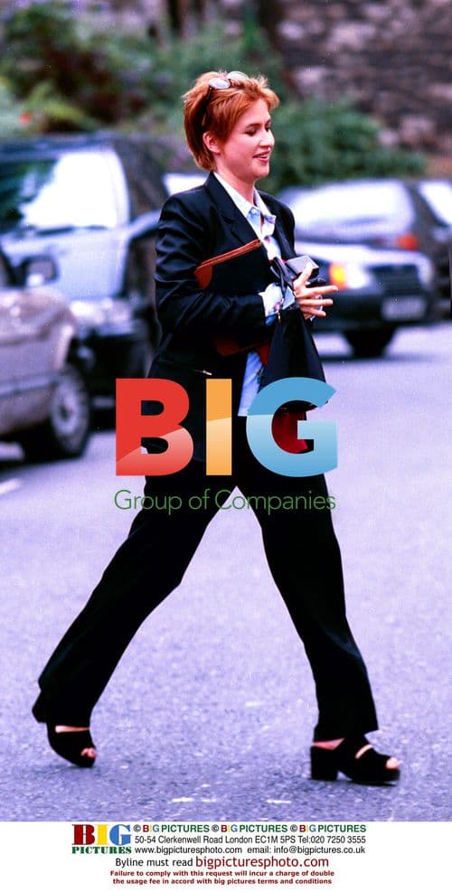 Emma Forbes in Black Suit and Scarf