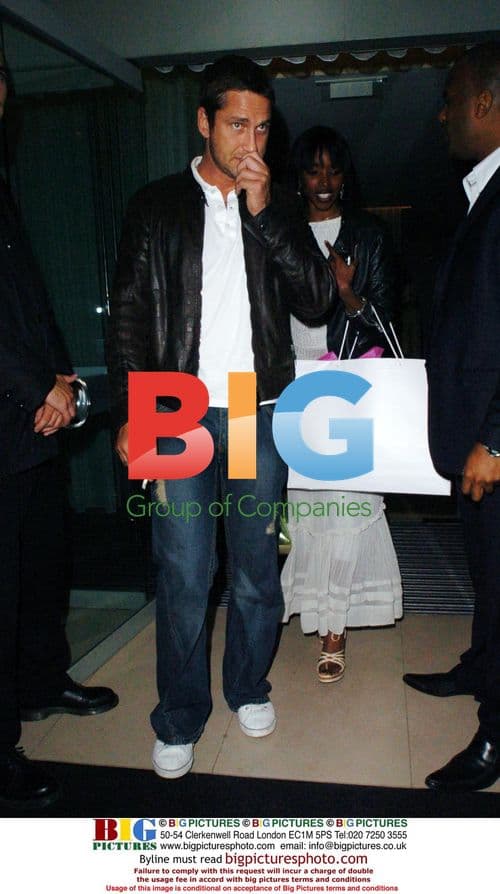 Gerard Butler and Josie D'Arby leaving event in London