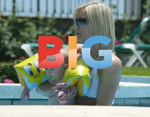 Suzanne Shaw and Child in Pool on Holiday