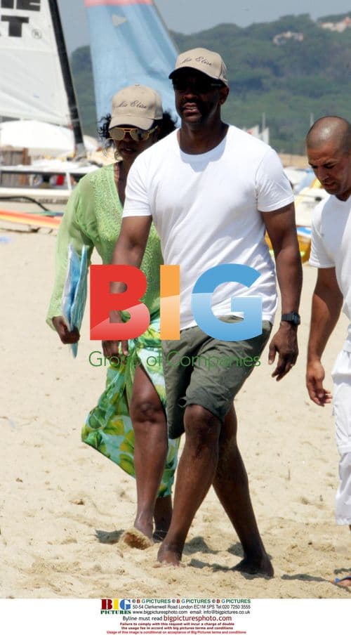 Denzel Washington and wife on beach