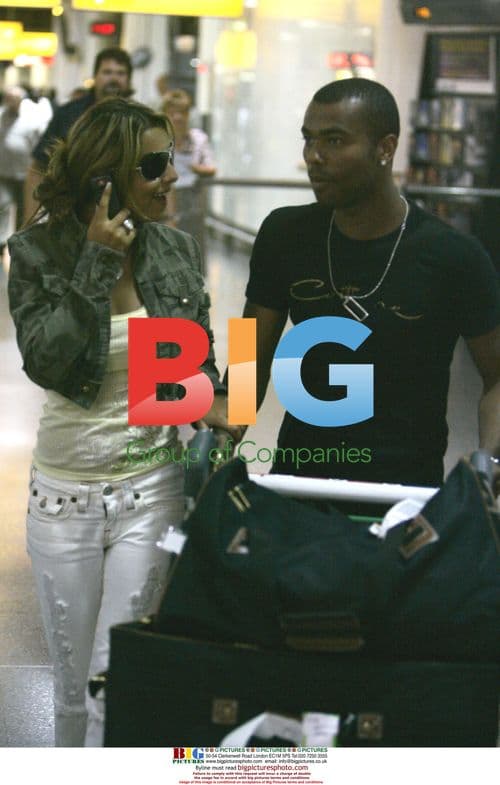 Ashley Cole and Cheryl Tweedy at London Airport