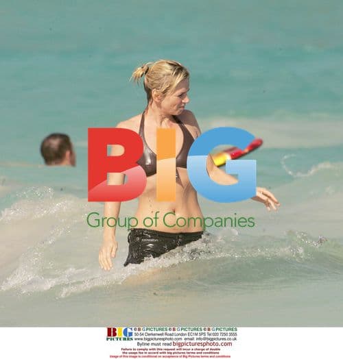 Norman 'Fatboy Slim' Cook and Zoe Ball swim in Mustique