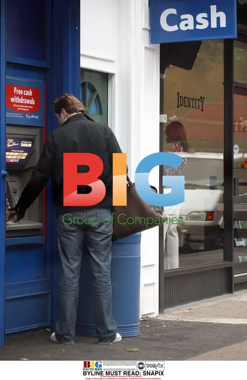 David Walliams using cash machine in London