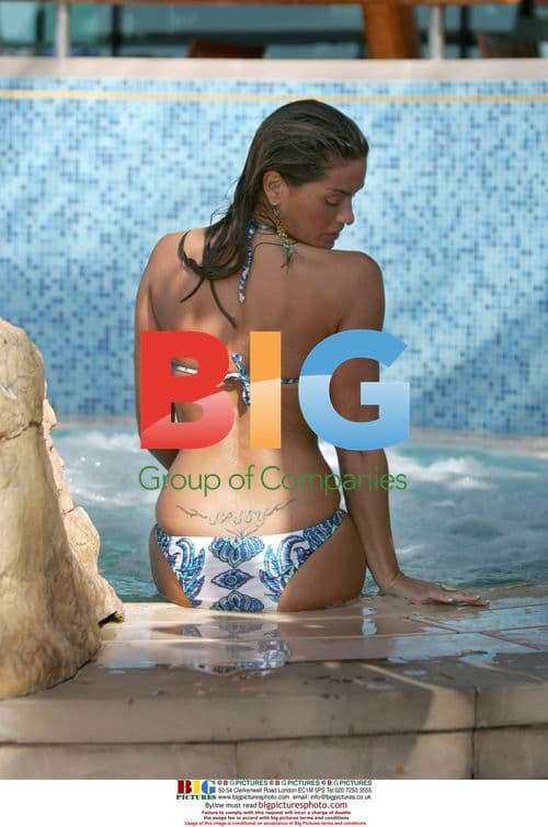 Sexy DJ Sassy relaxes in Dubai pool