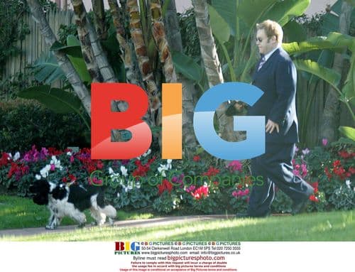 Elton John walks dog before shopping