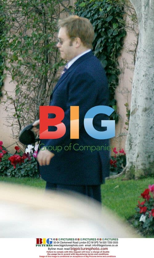 Elton John walking dog in Beverly Hills