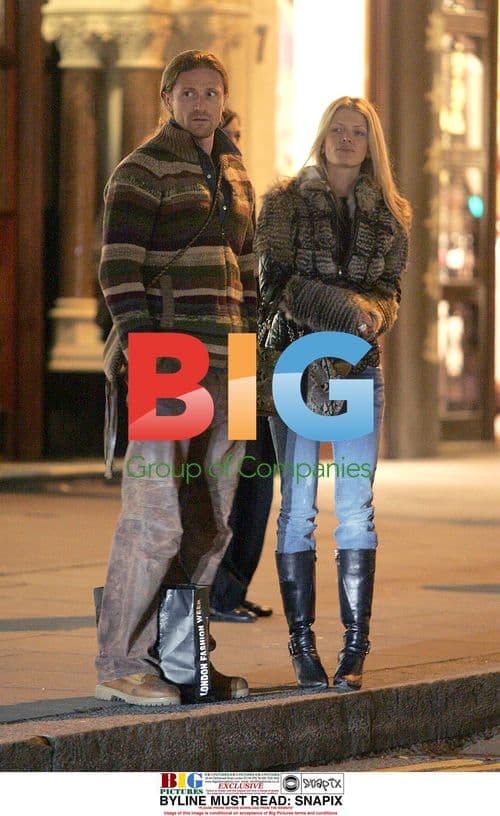 Footballer Emmanuel Petit and girlfriend shopping