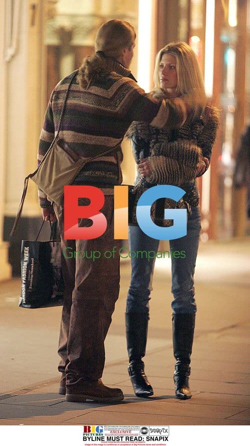 Footballer Emmanuel Petit and girlfriend shopping in London