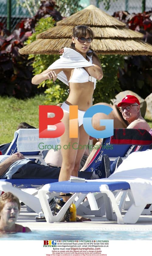 Singer Javine Suns Herself at Pool