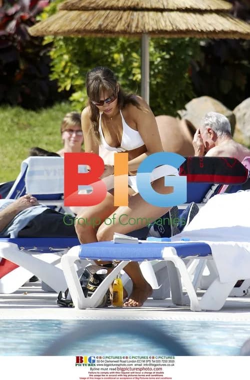 Singer Javine sunbathes on holiday