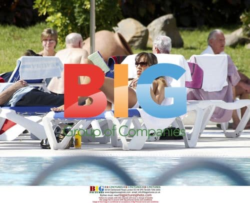 Singer Javine Sunbathes on Holiday