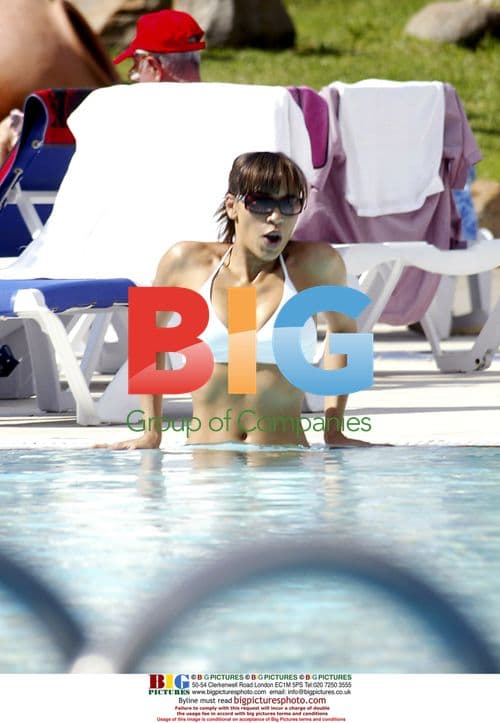 Singer Javine Sunbathing on Holiday