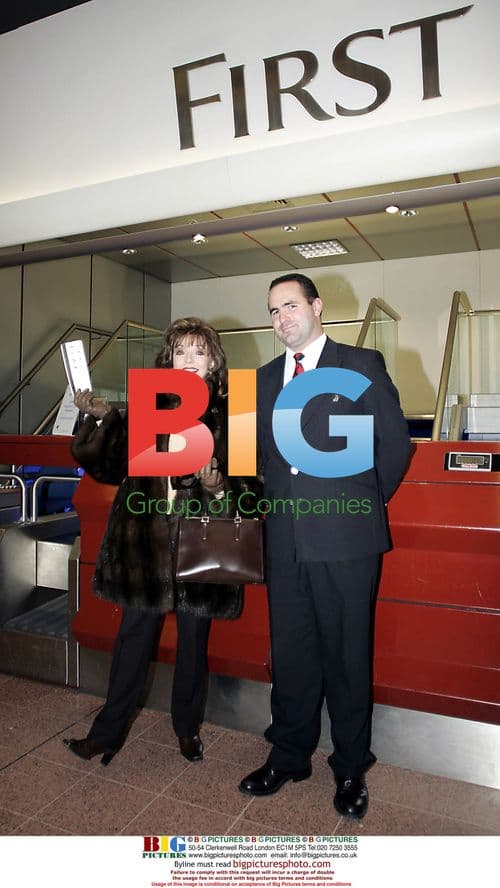 Joan Collins Arrives at Heathrow with First Luggage