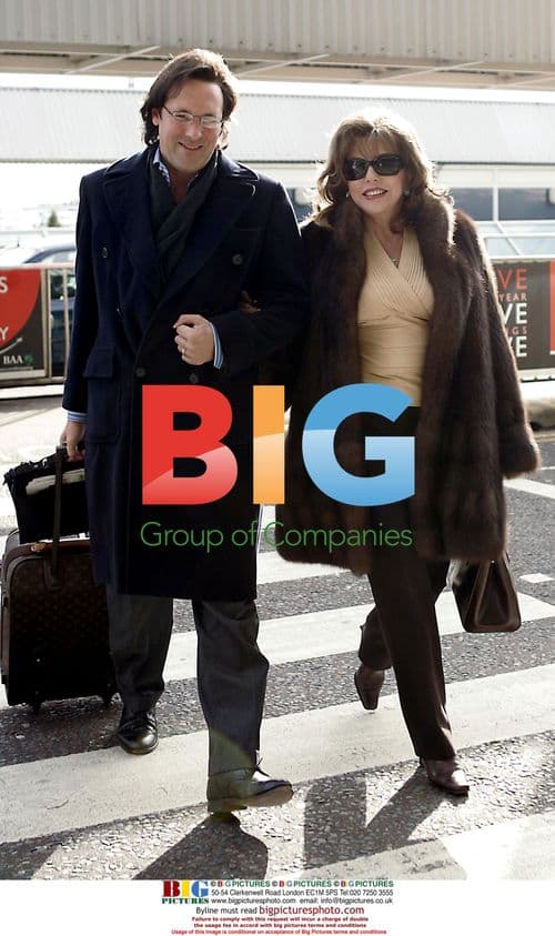 Joan Collins Arrives at Heathrow with First Luggage