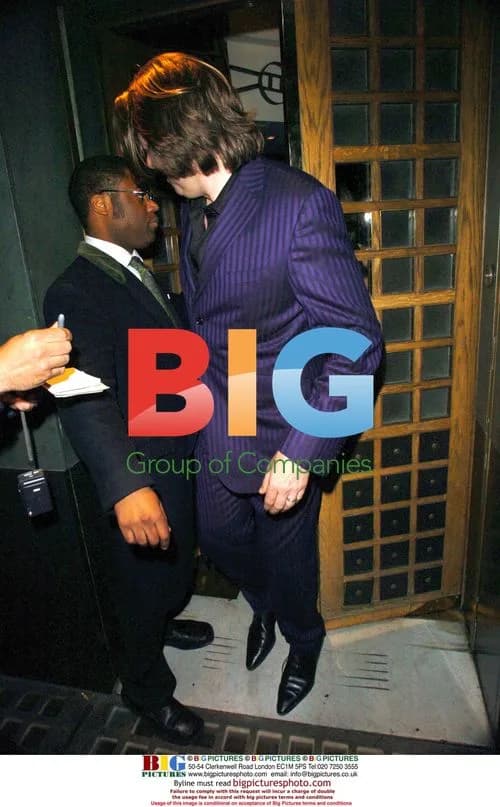 Jonathan Ross and wife at OBE party