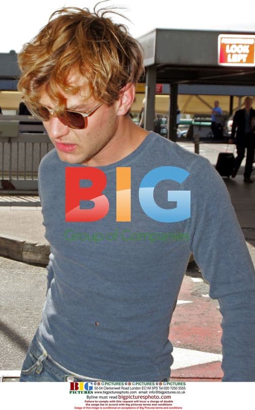 Jude Law and Sienna Miller at Heathrow