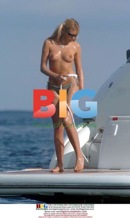 Leah Newman Relaxes Topless on Yacht