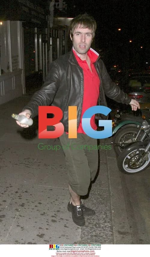 Liam Gallagher soaks photographers with beer