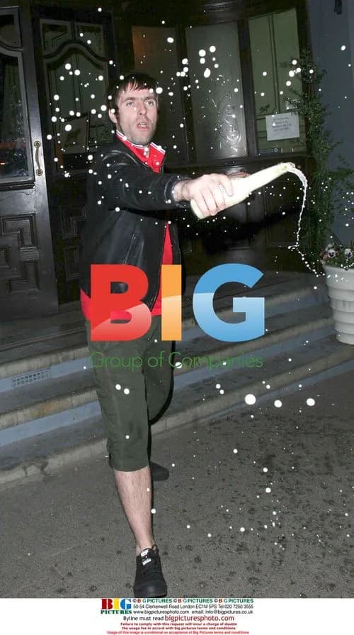 Liam Gallagher sprays beer on paparazzi in London