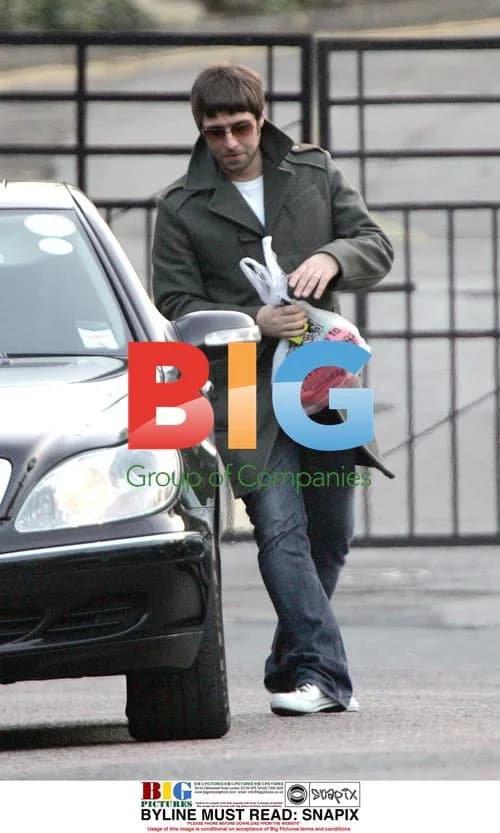 Liam Gallagher carries Morrisons bag in London