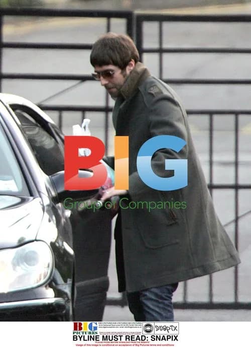 Liam Gallagher carries Morrisons bag in London