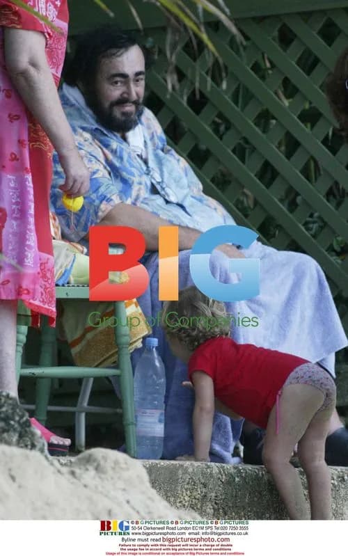 Pavarotti Relaxes With Family on Beach