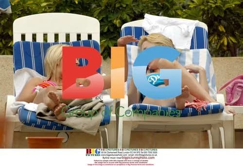 Glamour models Michelle Marsh and Jo Hicks poolside