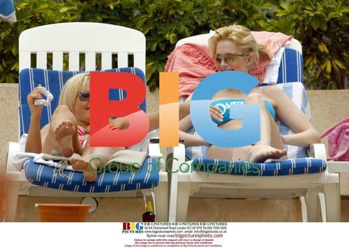 Michelle Marsh and Jo Hicks Relaxing by Pool