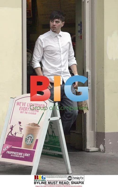 Matt Jay Grabs Water at London Coffee Shop