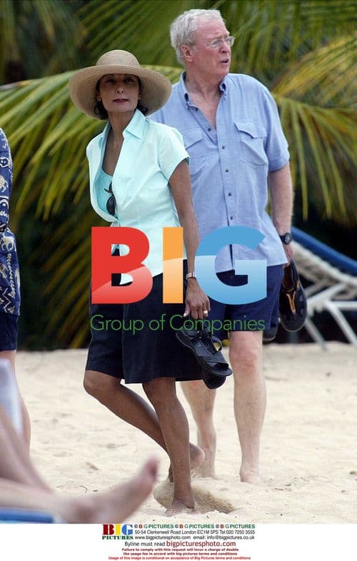 Michael Caine Takes a Rainy Beach Walk in Barbados