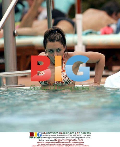 Michelle Heaton and Andy Scott-Lee by pool