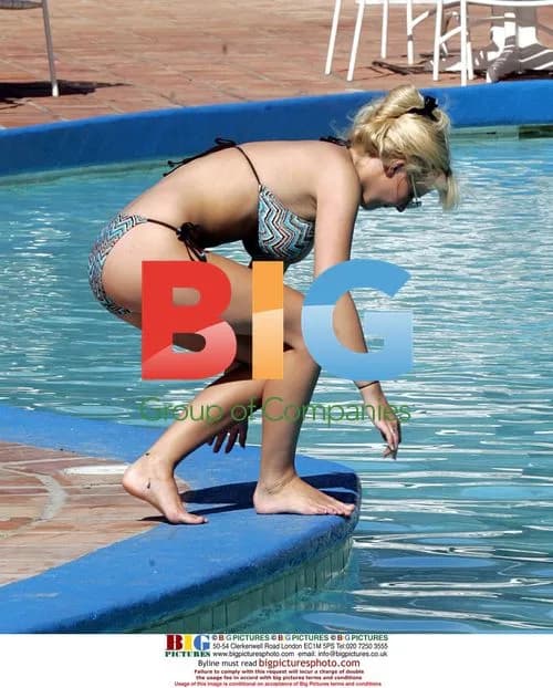 Michelle Marsh Sunbathing by Pool in Caribbean