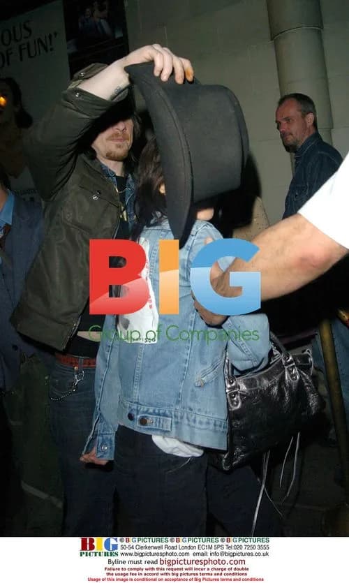 Natalie Imbruglia shielded by husband in London