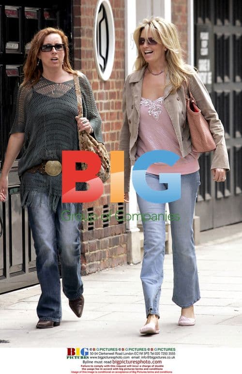 Penny Lancaster Takes Sunny Stroll with Friend