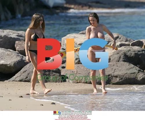 Glamour Models Lucy Pinder and Sophie Howard Relax on Beach