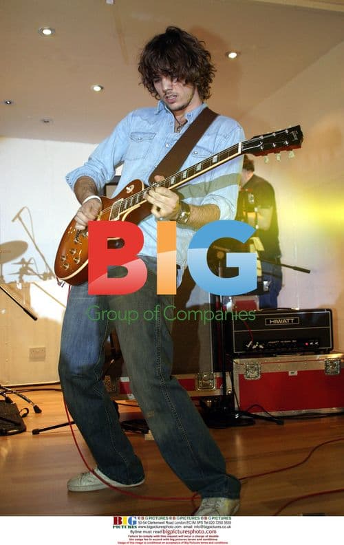 Rooster Bandmates Perform on Stage