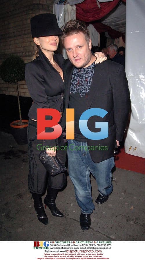 Photographer Rankin and partner at exhibition opening