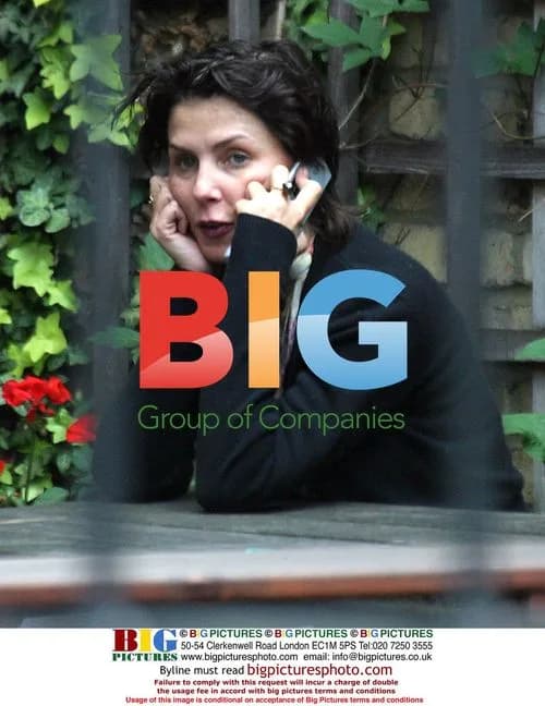 Sadie Frost using phone outside London pub