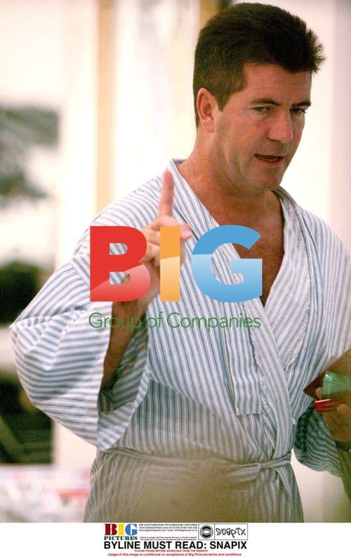 Simon Cowell Gets Hair Cut in London