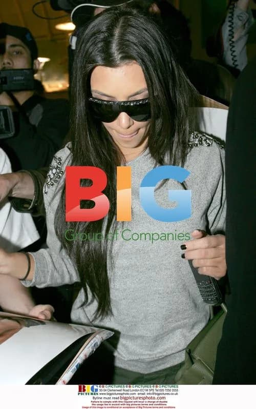 Kim Kardashian Signs Autographs at LAX