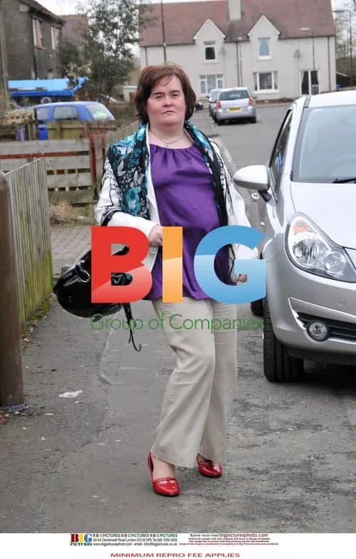 Susan Boyle Poses Outside Home