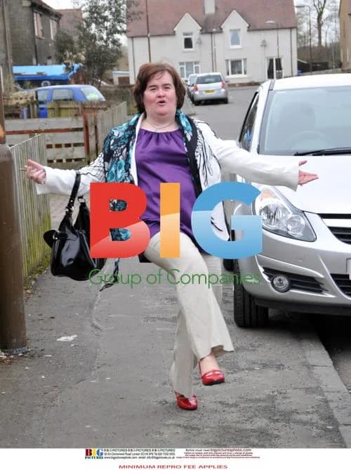 Susan Boyle Poses Outside Home