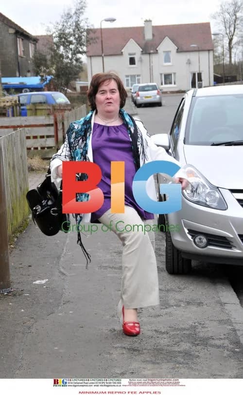 Susan Boyle Poses Outside Home