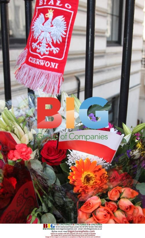 Mourners gather at Polish Embassy in London