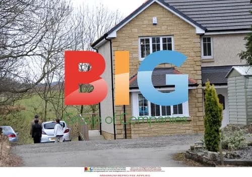 Susan Boyle Poses Outside Home