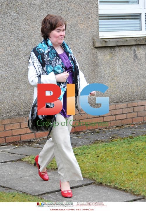 Susan Boyle Poses Outside Home