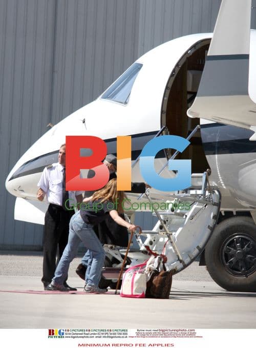 Dennis Hopper Boards Private Jet with Family