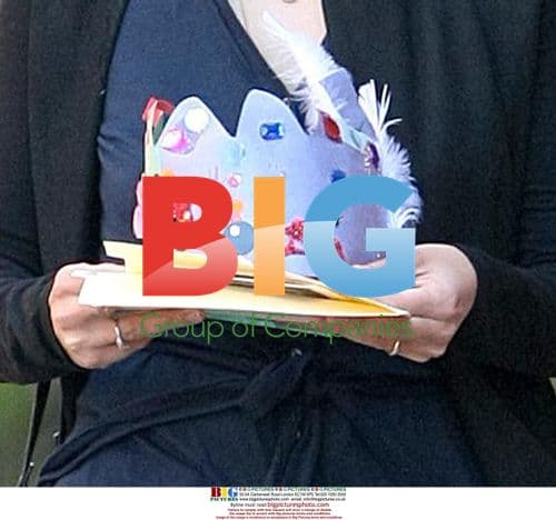 Maggie Gyllenhaal Carries Paper Crown