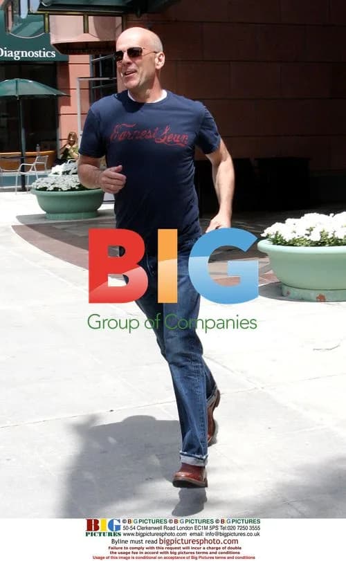Bruce Willis Playfully Runs From Medical Center